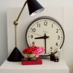 Vintage-clock-decorating-a-modern-bedside-table