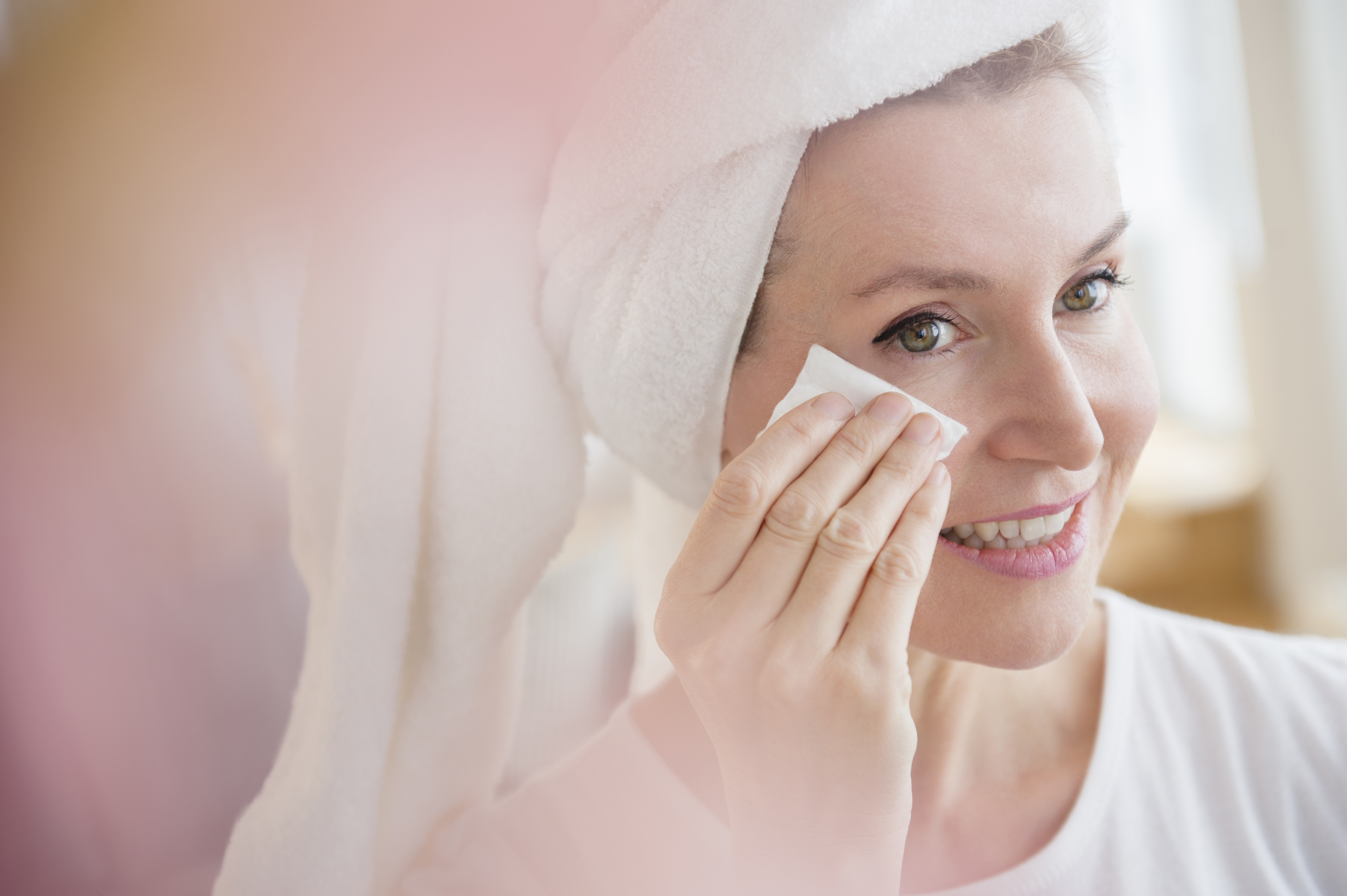 Caucasian woman wiping face